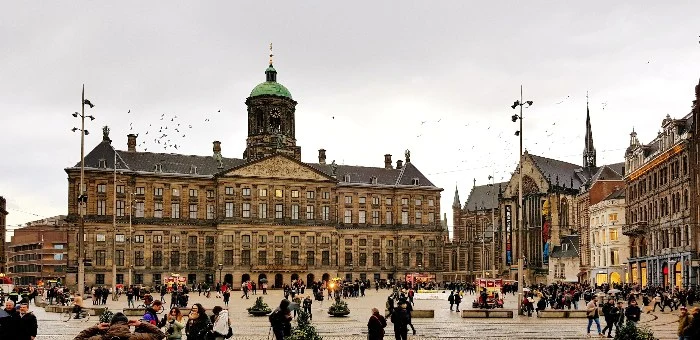 The palace and other buildings line Dam Square in Amsterdam