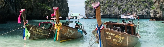 A row of traditional Thai boats