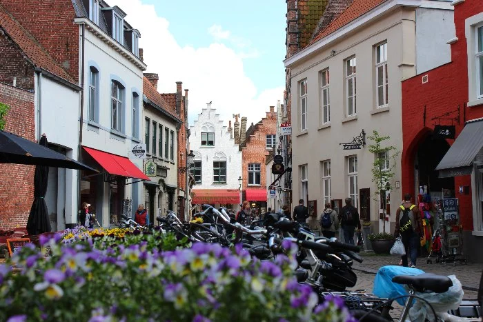 Houses and bikes line an alley in Bruges