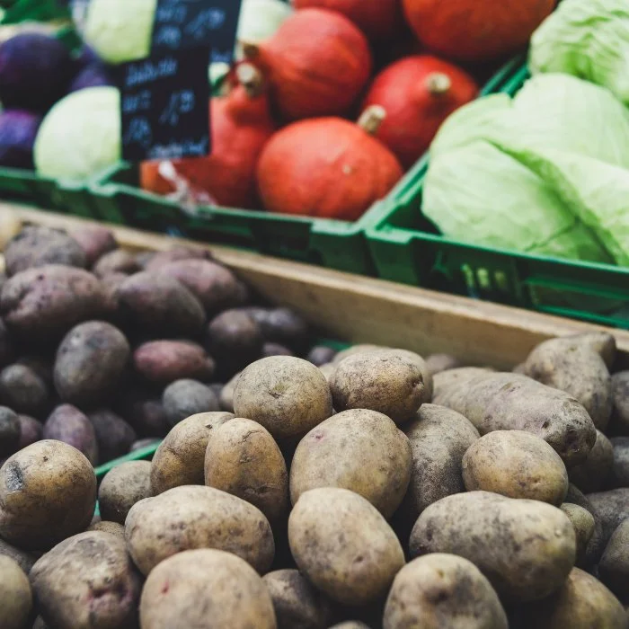 potatoes, cabbage and pumpkins at a market