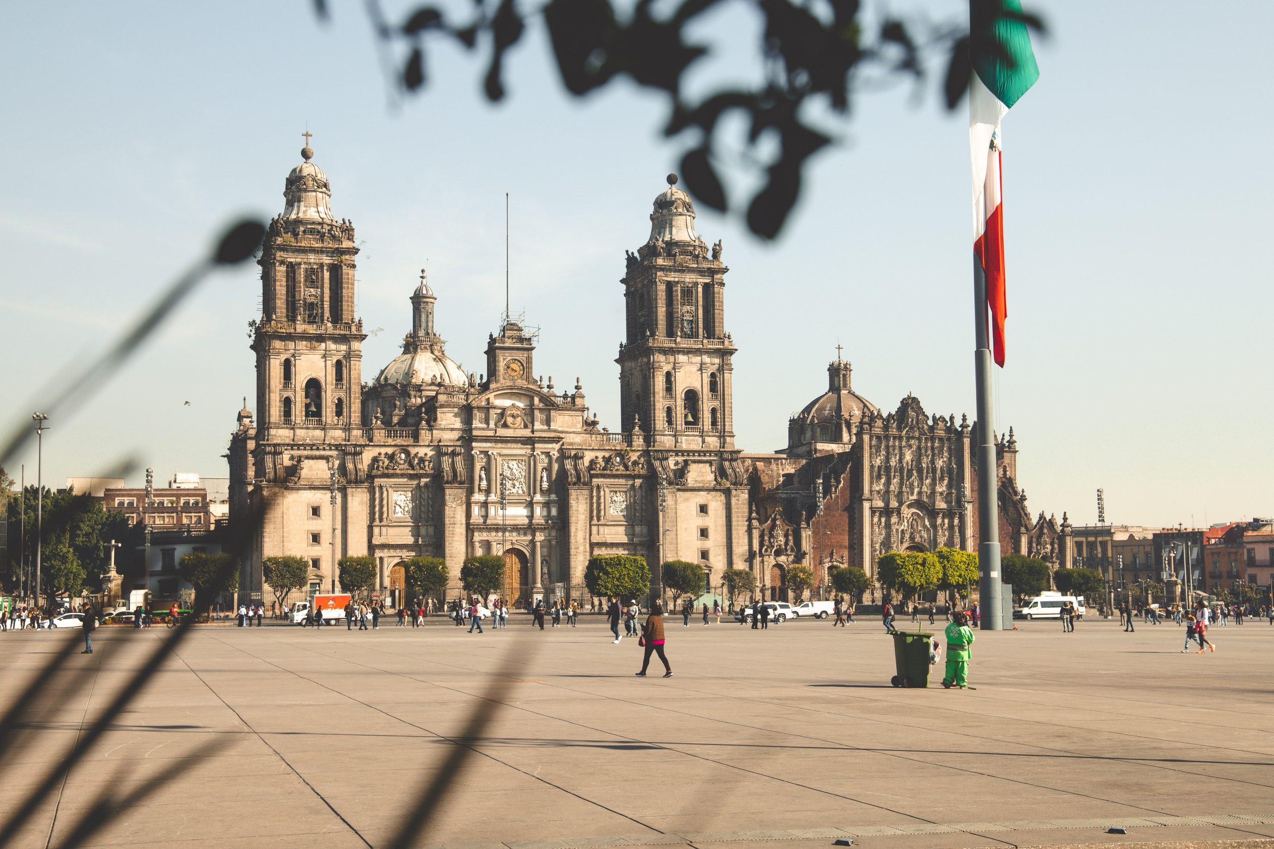A grand building and a Mexican flag