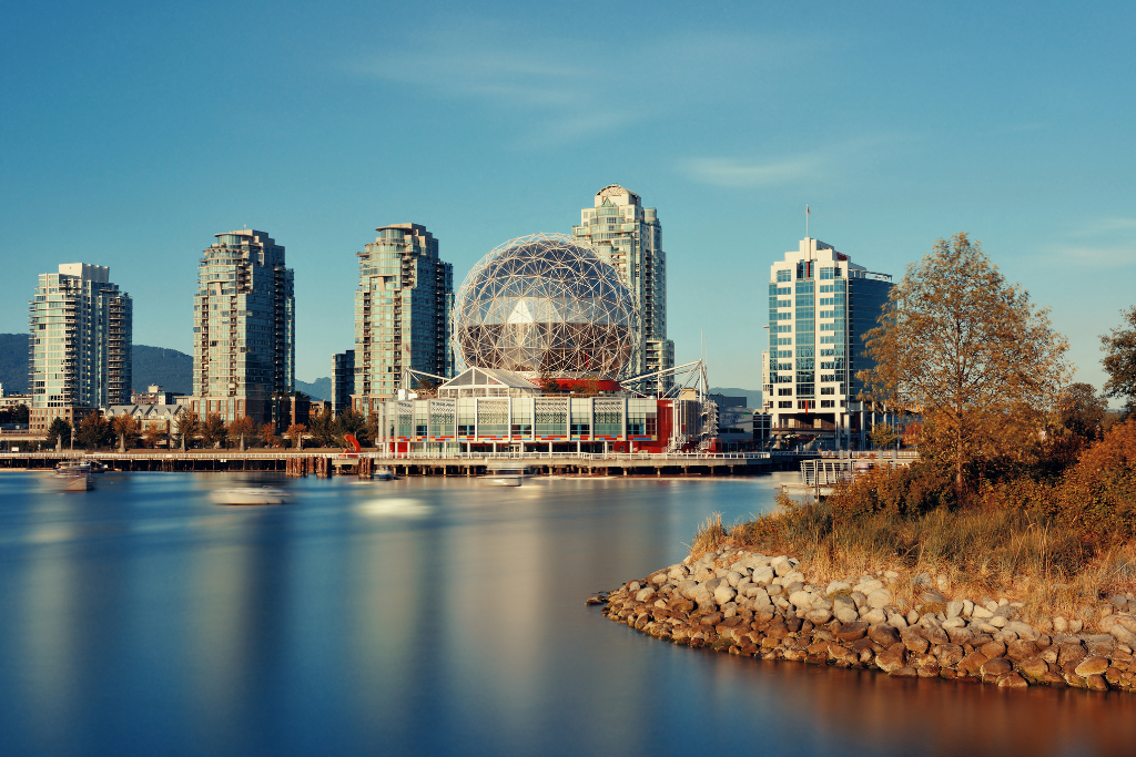 Vancouver skyline with Science World and waterfront apartments, reflecting work-travel opportunities in urban settings.