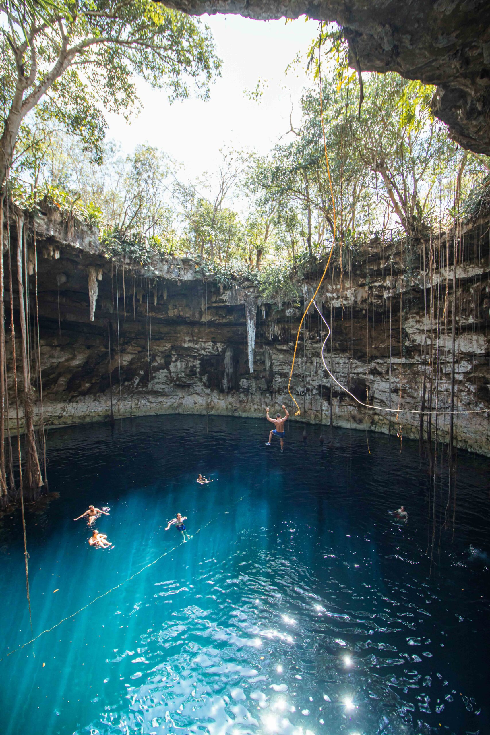 Crystal-clear cenote in Tulum, Mexico, an affordable warm winter escape for students looking for adventure.