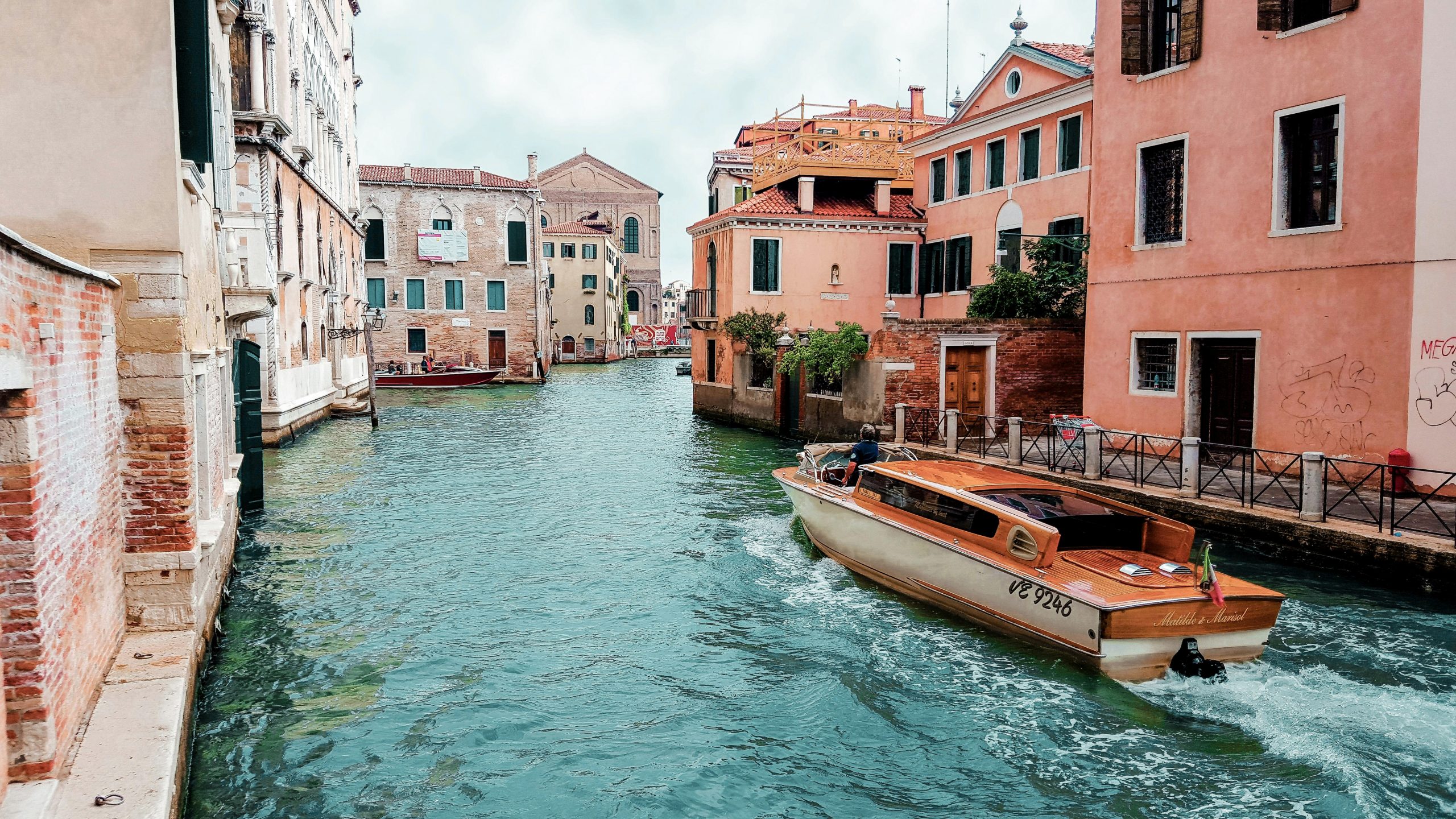 Venice canal boat ride, quiet alternative tourist spot away from crowded main attractions.