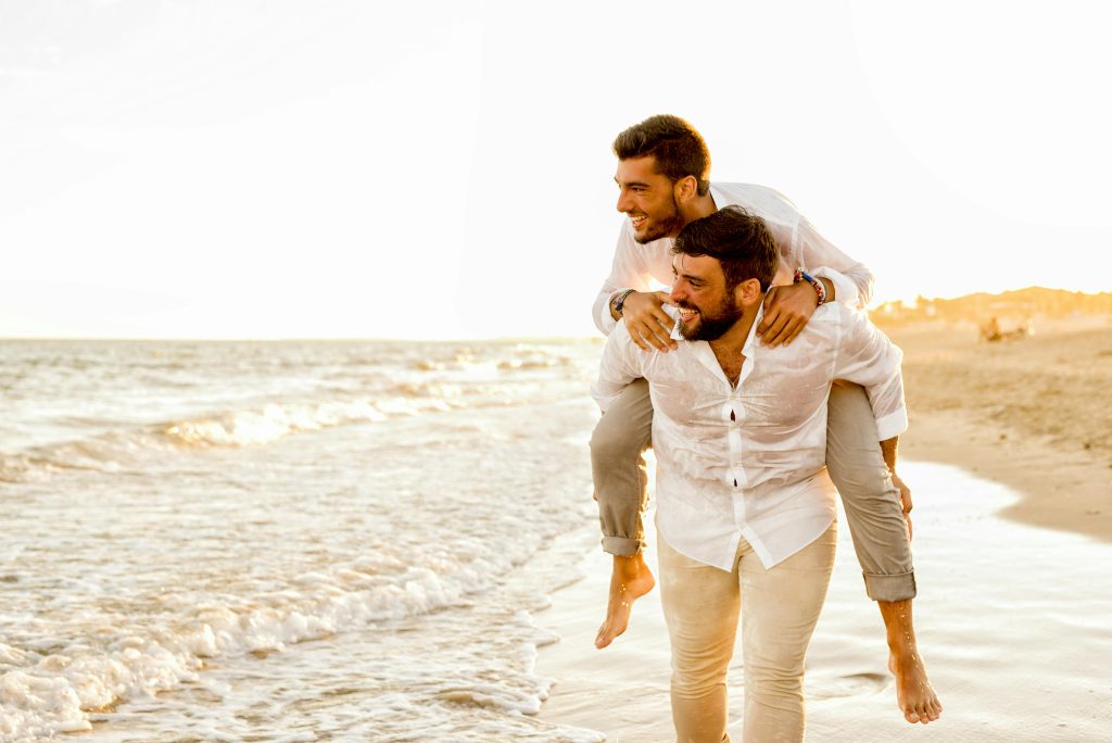College couple enjoying a romantic Valentine’s weekend by the beach