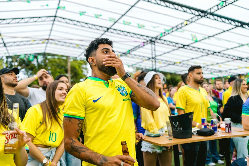 Brazil soccer fans watching a FIFA World Cup match at an outdoor fan zone